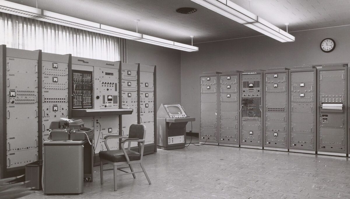 black and white photo of an early computer room
