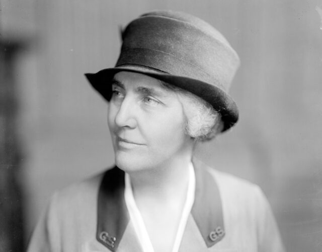 Black and white photo portrait of woman in uniform