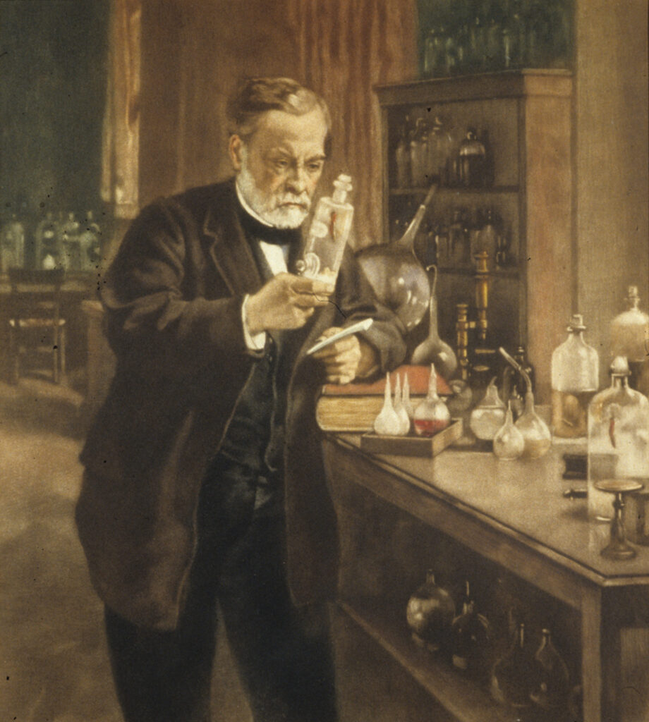 Louis Pasteur in his laboratory, holding a jar containing the spinal cord of a rabbit infected with rabies, which he used to develop a vaccine against the disease. 