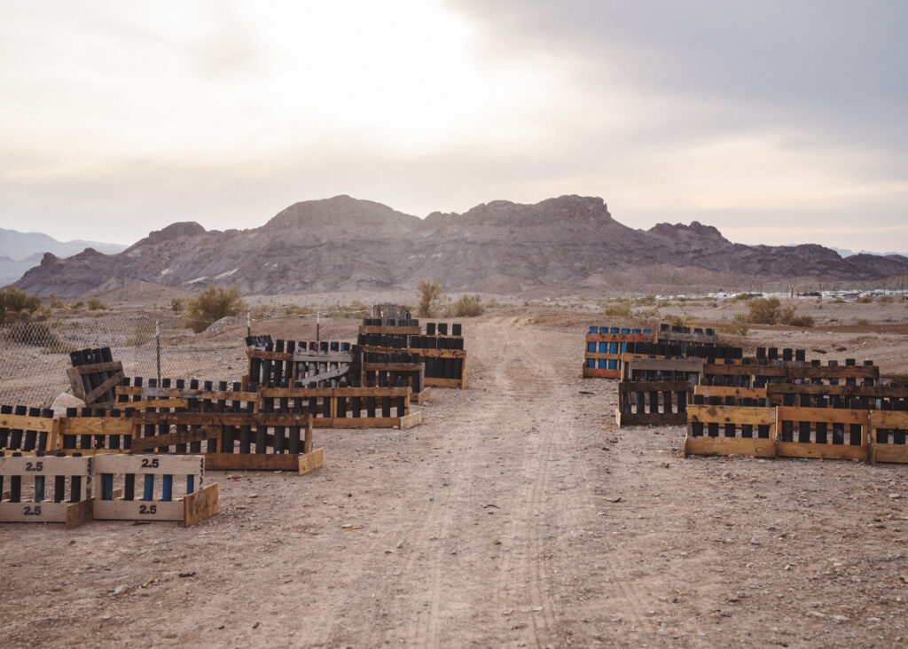 Landscape photo of desert scene with a large number of wooden mortar rigs