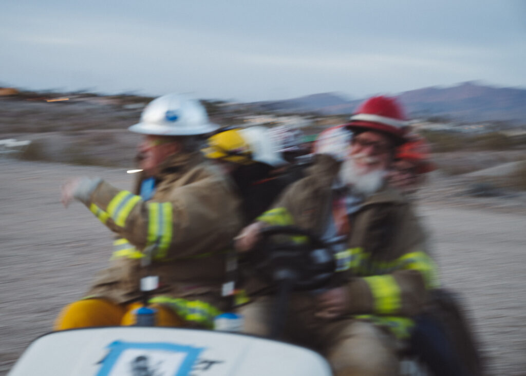 Blurry photo of people in safety gear driving golf cart