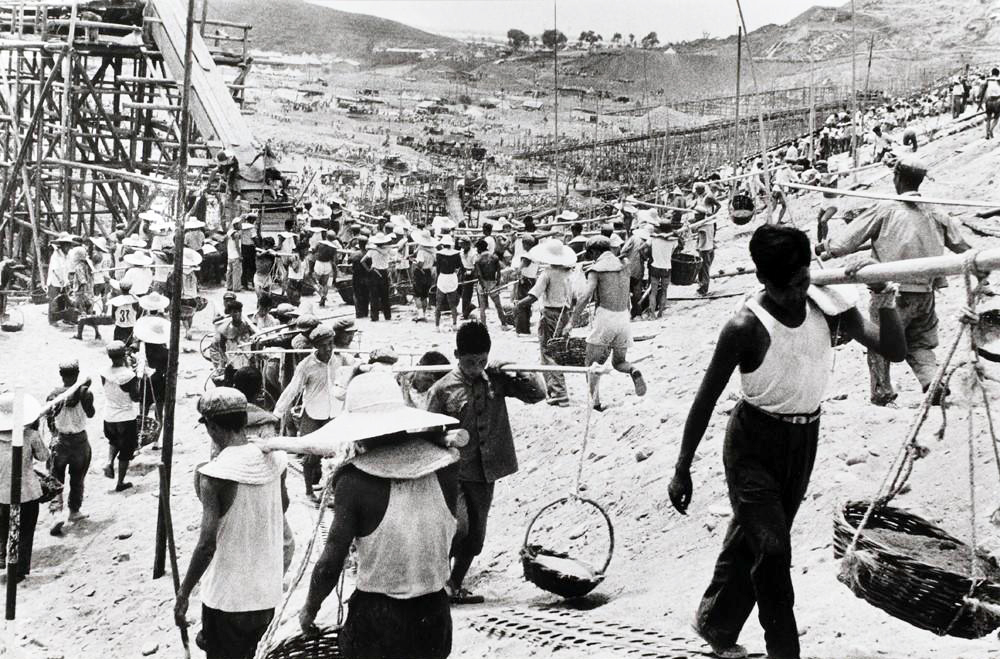 Black and white photo of workers at a job site