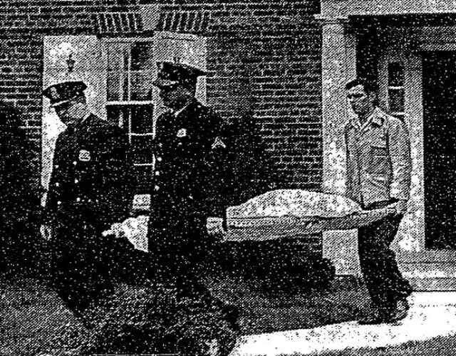 Newspaper clipping of Paul Stoutenburgh being carried out by a medical examiner.