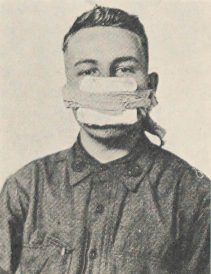 Portrait of young man wearing simple cloth mouth covering