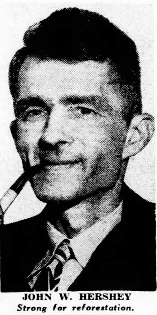 Black and white photo of a man with a pipe in his mouth