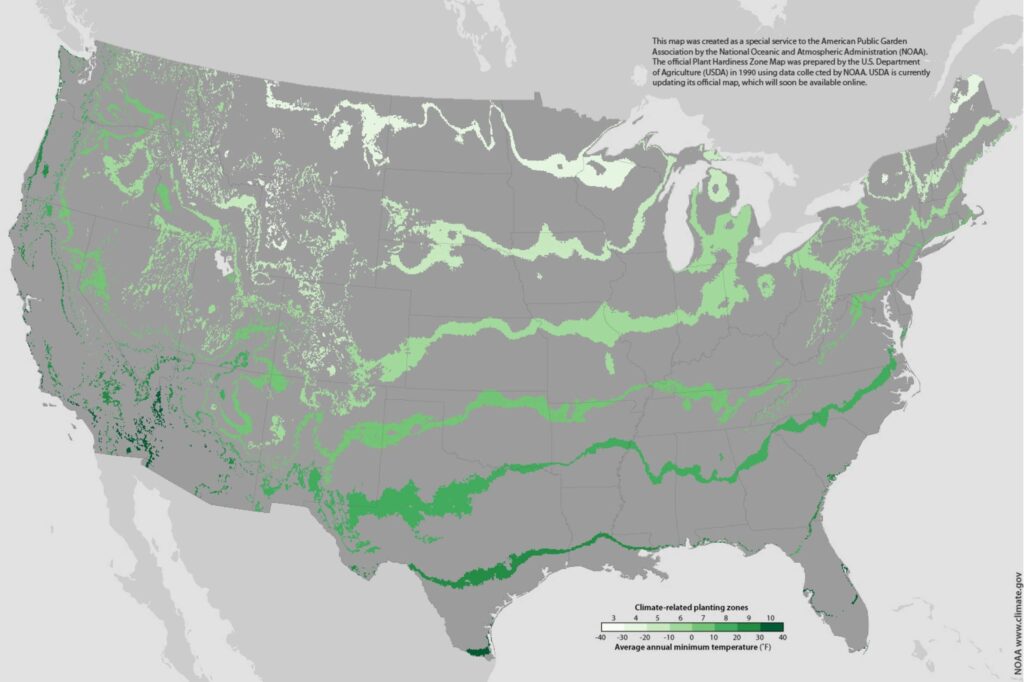 Grey map of the United States with green bands showing warming regions