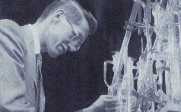 black and white photo of a man in a lab