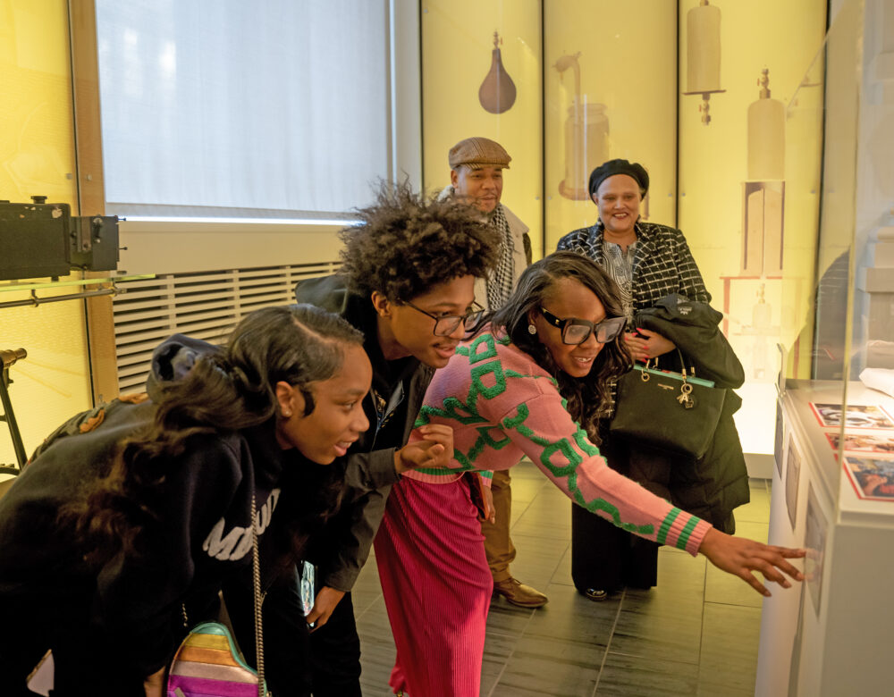 Visitors enjoy Superheroes and the Environment display