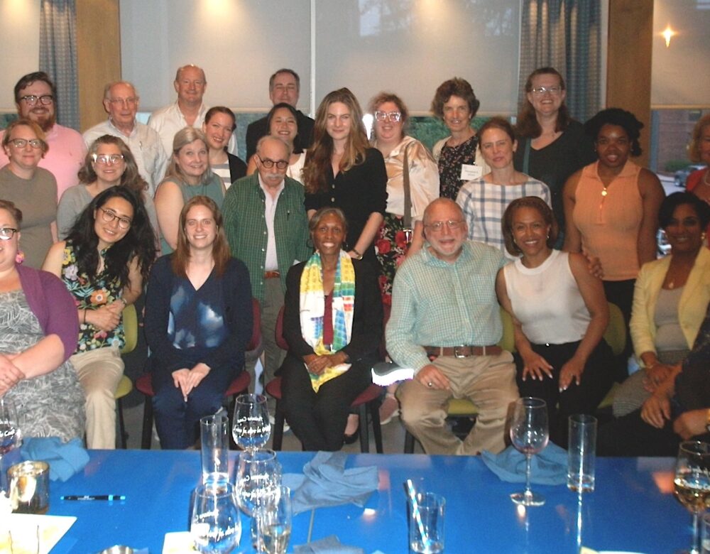 group of men and women at a conference