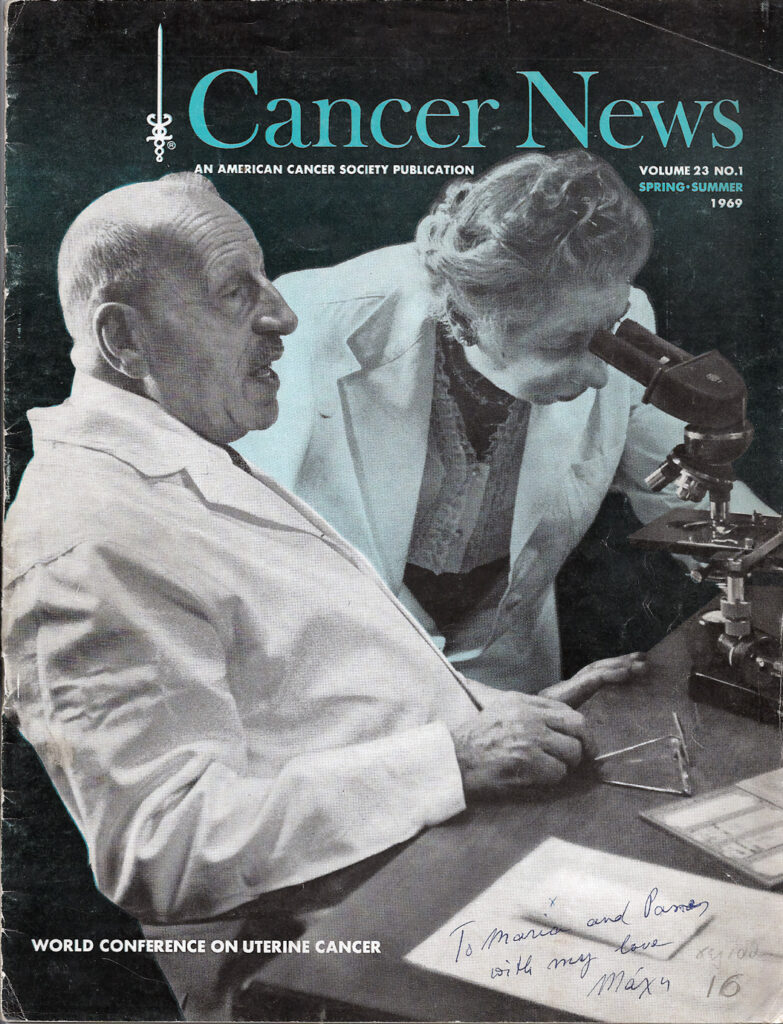 Old magazine cover showing an older man and women in lab coats, the man is talking and the woman is peering into a microscope