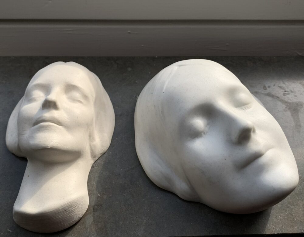 Two plaster masks of a woman