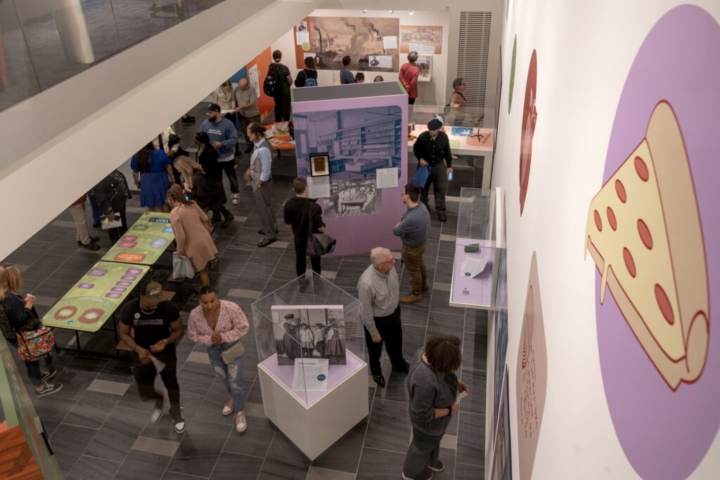 Museum visitors attend the opening of our Lunchtime exhibition.