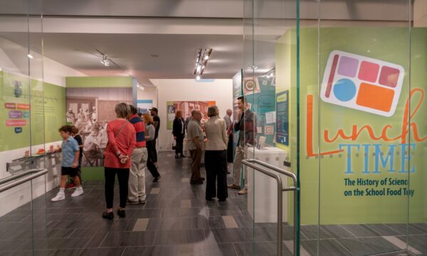 people standing in a museum exhibit