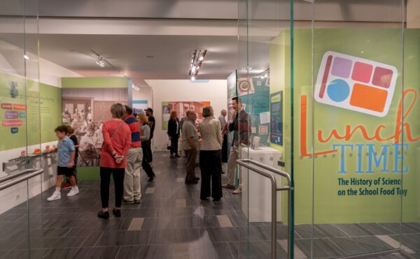 people standing in a museum exhibit