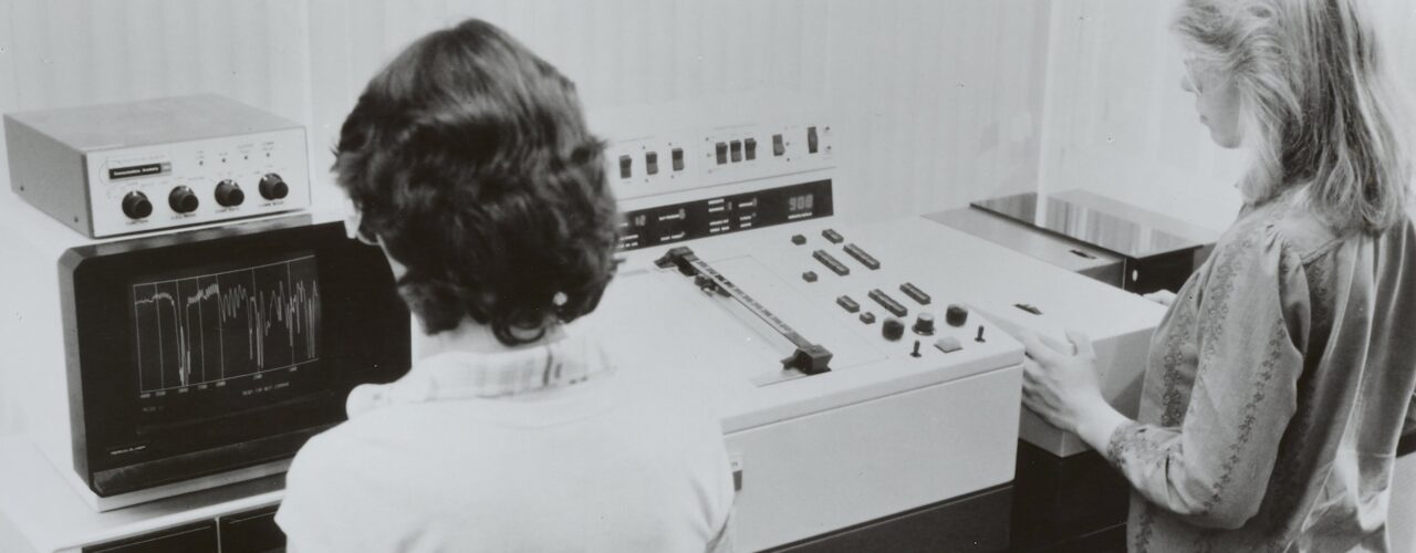 2 women using scientific equipment