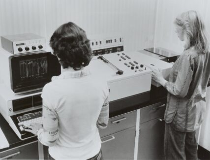 2 women using scientific equipment