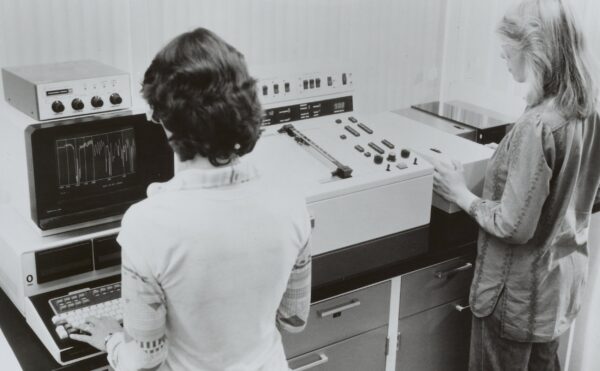 2 women using scientific equipment