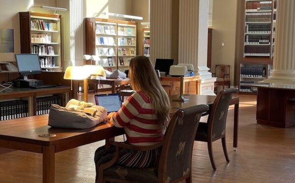 person doing research in a library