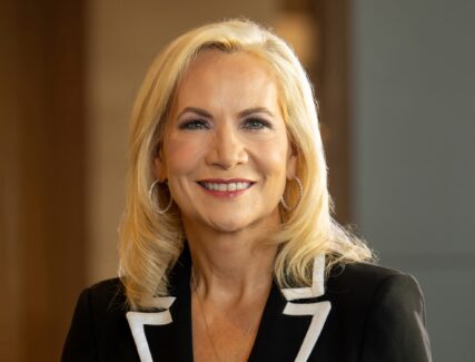 headshot of a blond woman in a suit jacket