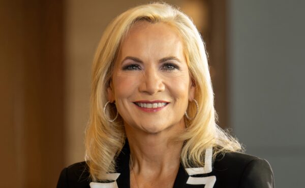 headshot of a blond woman in a suit jacket