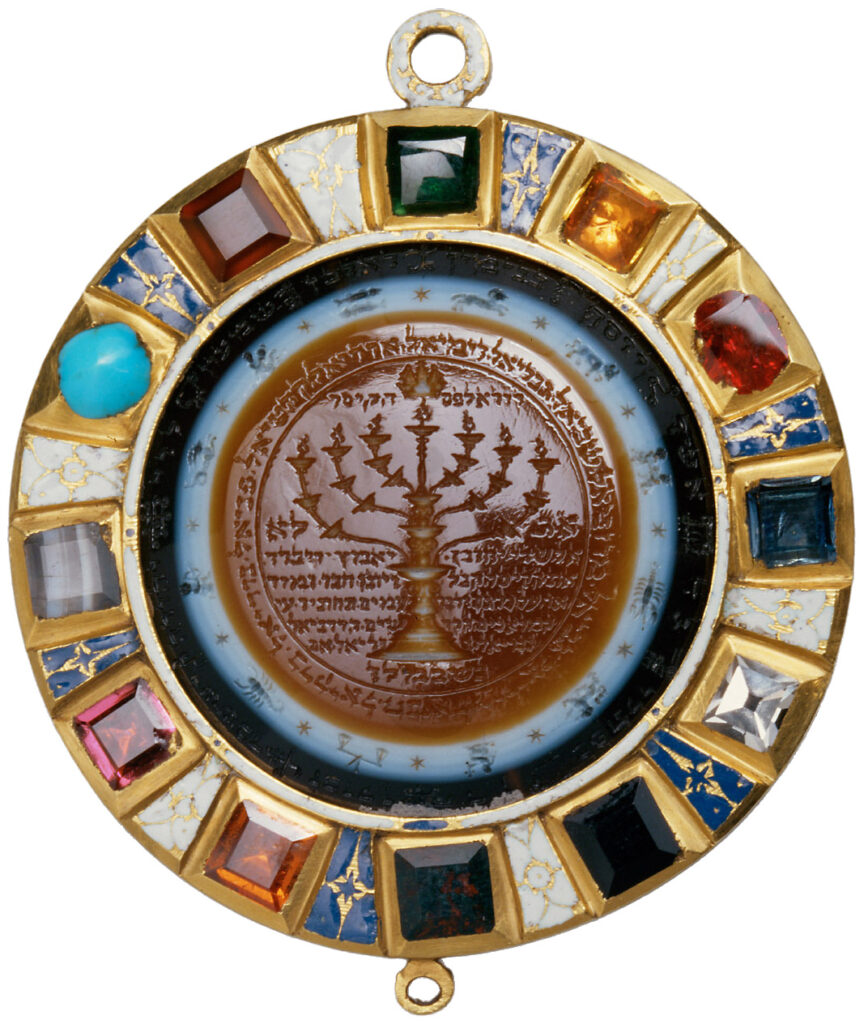 Golden amulet embedded with 12 different precious stones, inscribed with astrological symbols, Hebrew text, and a menorah